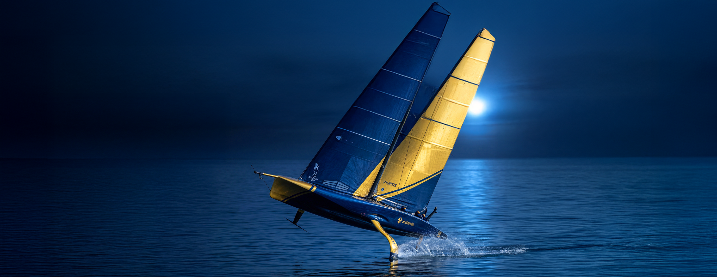 Blue and gold racing sail boat at night with moon in background